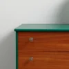 Close-up of a wooden drawer unit with green trim from Stringers Home Decorating Centre, showcasing quality craftsmanship and stylish design.