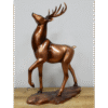 Bronze stag ornament with detailed antlers on a wooden base, ideal for home decorating and festive displays.