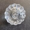 Clear glass ribbed cabinet knob with a decorative scalloped edge, ideal for enhancing furniture and cabinetry decor.