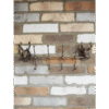 Decorative stag coat hook set of 4 with metal antlers and wooden base, mounted on a brick wall, ideal for rustic home decor.