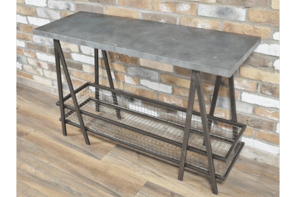 Industrial console table with a metal frame and a concrete top, featuring a lower wire mesh shelf, set against a brick wall background.