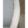 Close-up of a silver industrial round mirror with a textured frame, showcasing its reflective surface and modern design.