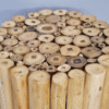Decorative wooden side table made from vertically arranged natural wood logs with cross-section details.