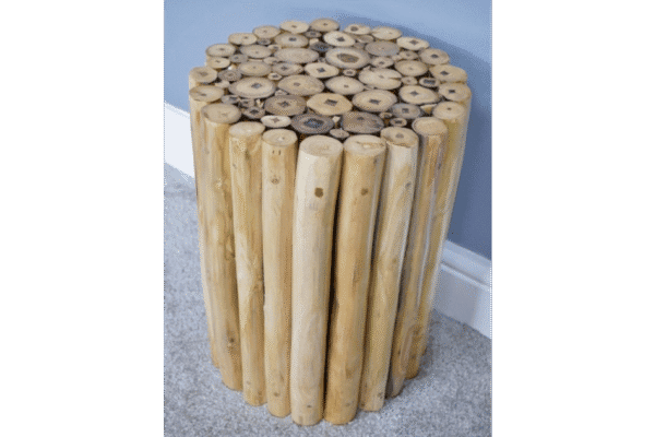 Unique wooden side table made from vertically arranged natural logs with a polished top surface.