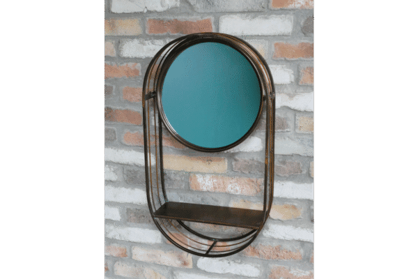 Industrial wall mirror with a black metal frame and a small shelf below, mounted on a brick wall.
