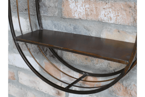 Industrial wall shelf unit with a mirror, featuring a black metal frame and a wooden shelf, mounted on a brick wall.