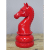 Red decorative chess piece knight made of glossy material, detailed mane and base, ideal for home decor or chess enthusiasts.