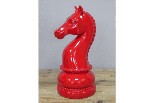 Red decorative chess piece knight made of glossy material, detailed mane and base, ideal for home decor or chess enthusiasts.