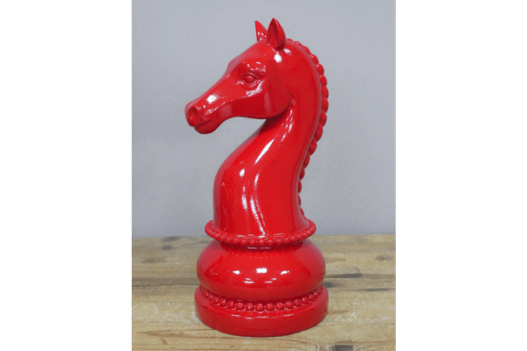 Red decorative chess piece knight made of glossy material, detailed mane and base, ideal for home decor or chess enthusiasts.