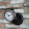 Handlebar bike clock with vintage design mounted on a brick wall, featuring a black round face and metal handlebars for a unique home decor piece.