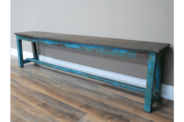 Blue distressed wooden bench with rustic finish, ideal for home decor or outdoor seating.