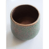 Aluminium pitted planter with textured surface, ideal for outdoor gardening and decorative plant displays.