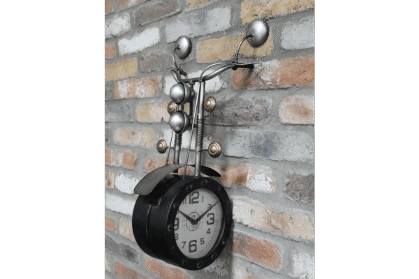 Unique wall clock designed as a motorbike with side facing view, featuring metallic details and a brick wall background.