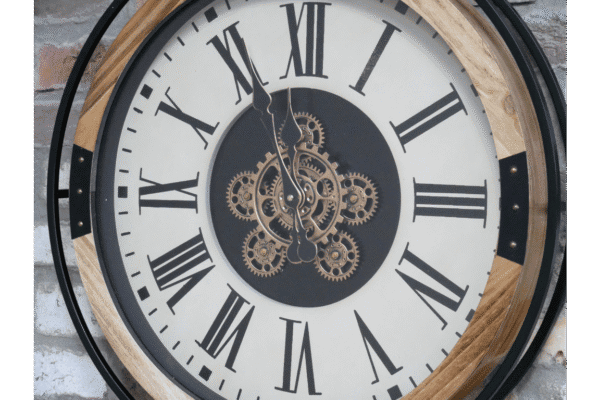 Cog clock with moving cogs and roman numeral lettering wood and black metal surround.