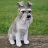 Stringers DIY Schnauser ornament depicting a detailed, realistic dog figurine with a grey and white coat, sitting on a wooden surface with a grassy background.