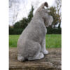 Stringers DIY Schnauser ornament made of stone, detailed sculpture of a sitting dog with textured fur and expressive face.
