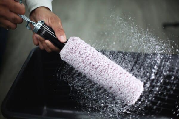 Axus Décor Blue Series Spin & Clean 44mm Core roller cleaning system. Roller sleeve being spun dry.