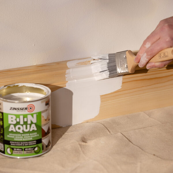 Zinsser B-I-N Aqua Primer 500ml – water-based stain blocker and all-surface sealer. Product being painted on bare skirting boards.