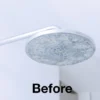 Close-up of a shower head with limescale buildup before using HG Limescale Remover Foam Spray.