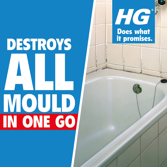 Bathroom with mouldy tiles and a bathtub, showcasing the need for HG Mould Remover Spray for effective cleaning.