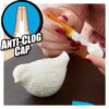 Close-up of a person applying Gorilla Super Glue with an anti-clog cap to a ceramic figurine, highlighting the quick-setting and clear bond features.