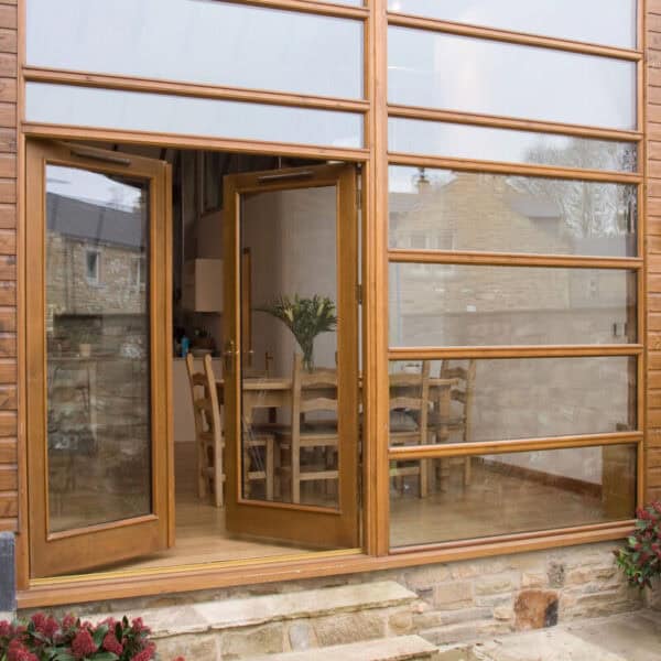 Exterior view of Stringers Home Decorating Centre showcasing wooden framed glass doors and windows.