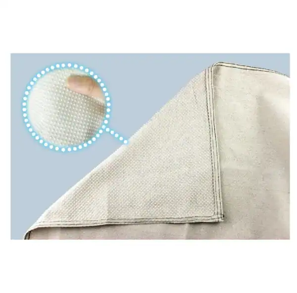 Heavy-duty dust sheet with non-slip textured surface for floor and furniture protection during decorating.