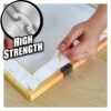 Close-up of a hand applying clear double-sided adhesive tape to a wooden surface, highlighting high strength and durability for mounting purposes.
