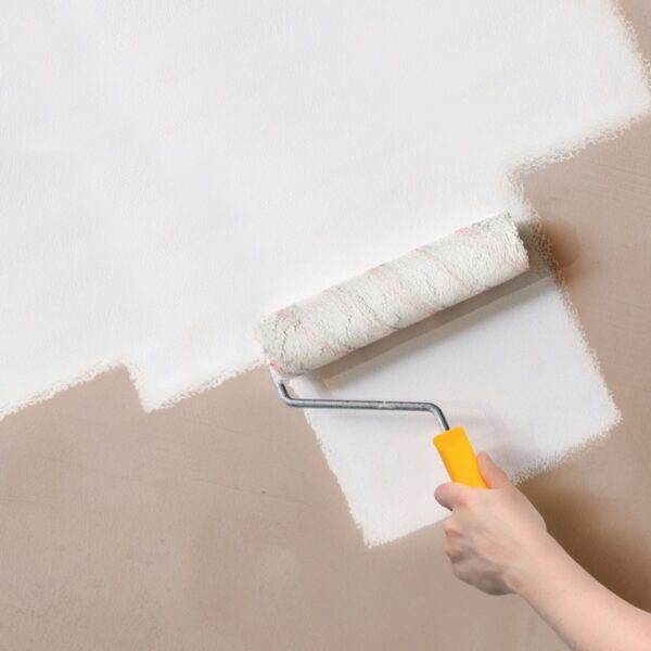Ronseal 3 in 1 Basecoat being applied to a bare plaster wall using a roller with yellow handle showing coverage in one coat