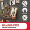 3m command strips image showing lots of pictures on the wall and showing no hammering, no injuries and no holes.