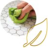 Cleaning surface with cloth using Pretty Boy paint cleaner.