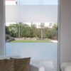 D-C-Fix glass frosting film applied in horizontal stripes to a large living room window