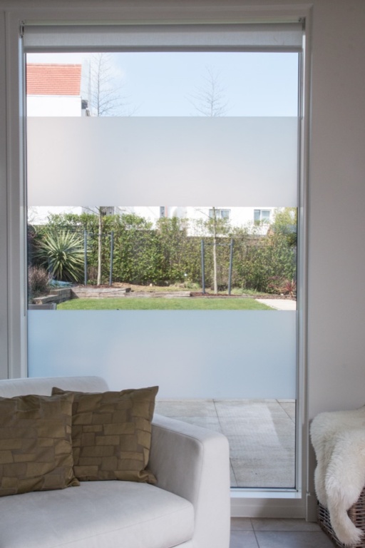 D-C-Fix glass frosting film applied in horizontal stripes to a large living room window